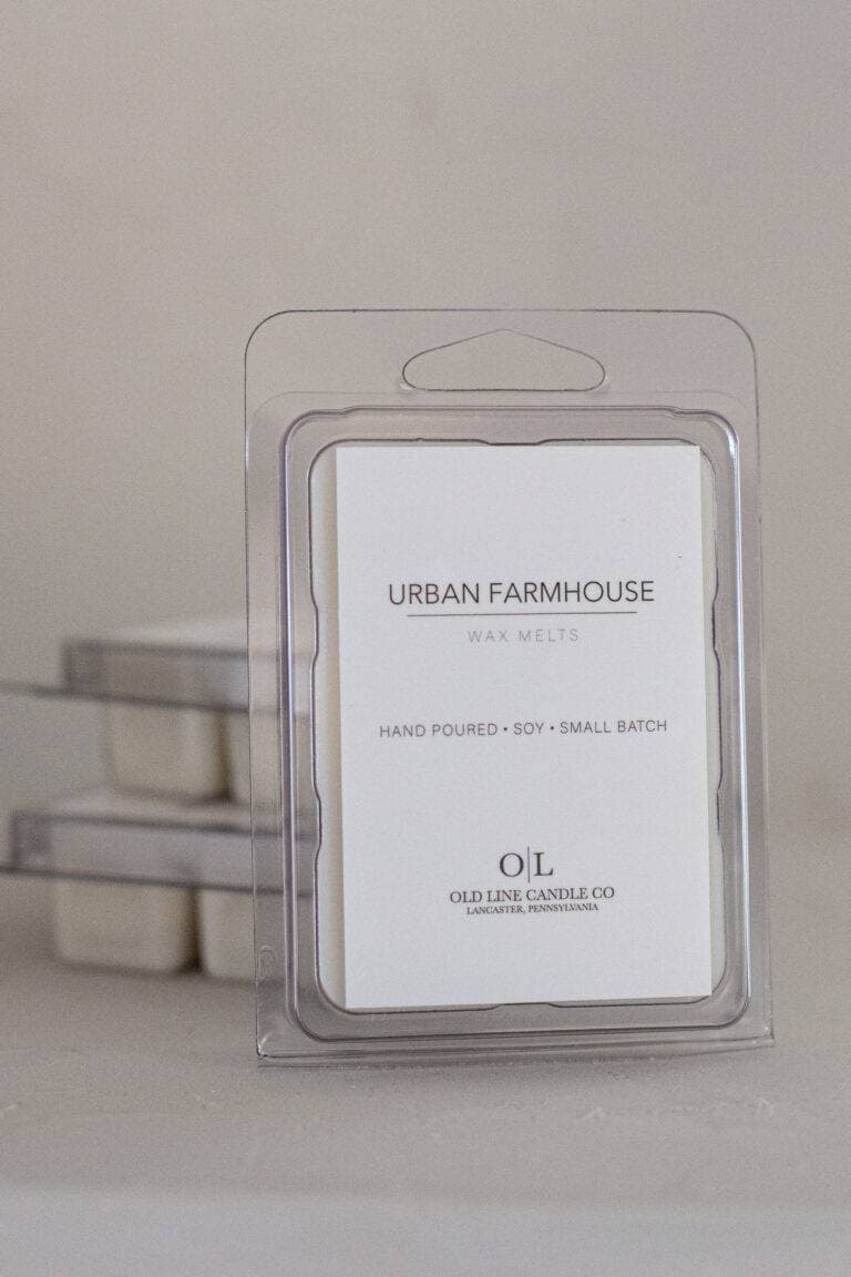 Clear packaging of Urban Farmhouse soy wax melts, labeled as hand-poured and small batch.